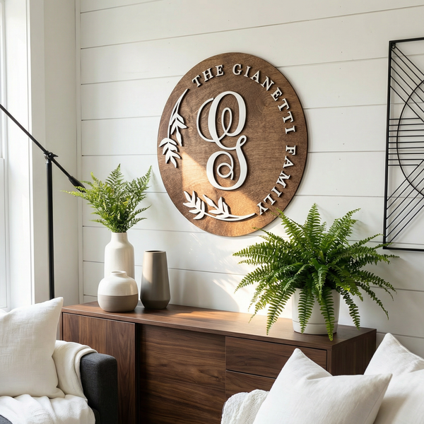 Custom wooden wall sign with an elegant monogram initial and a family name in bold, white 3D lettering