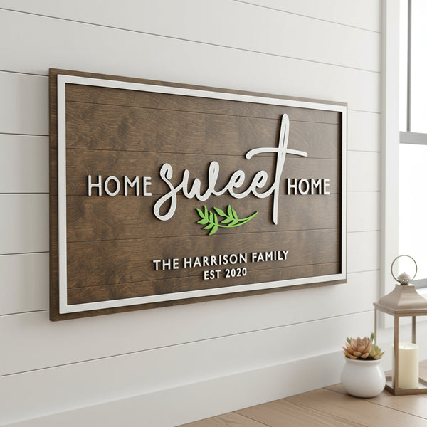 A laser cut wooden wall sign with a custom family name and a "Home Sweet Home" message.